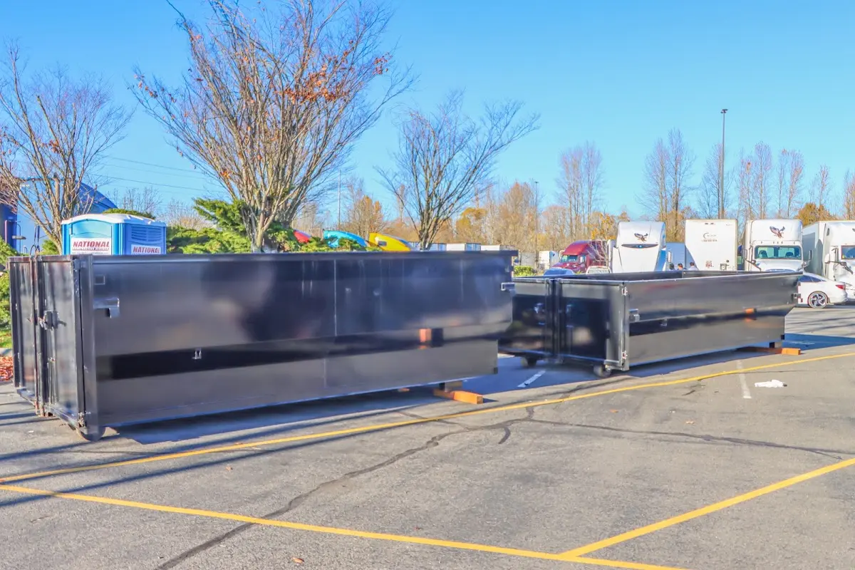 Professional dumpster rental service with roll-off container on residential driveway in North Las Vegas